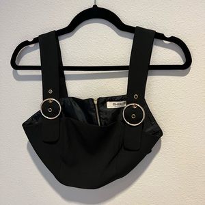 black crop top with gold buckle straps